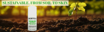 Bertoli Apple Stem Cell Serum: skincare product with a plant growing in the background, emphasizing sustainability.